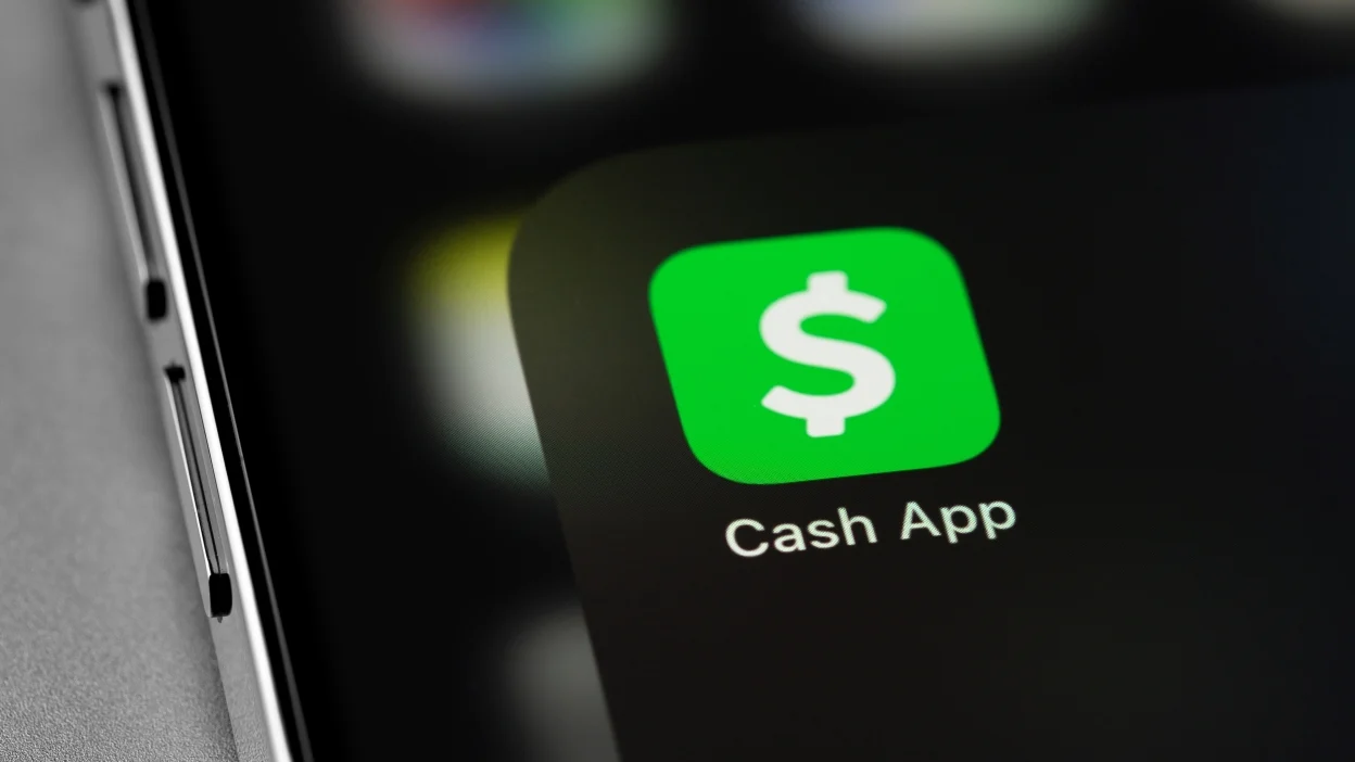 Cash App mobile app icon displayed on smartphone screen for digital payment and settlement services